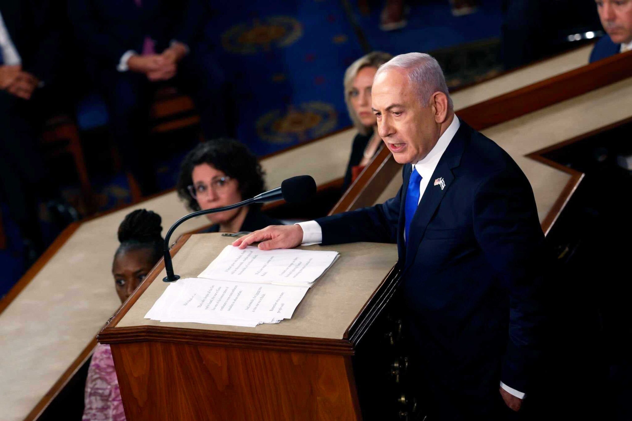 Netanyahu speaking at a lectern in the U.S. Congress in Washington, DC.