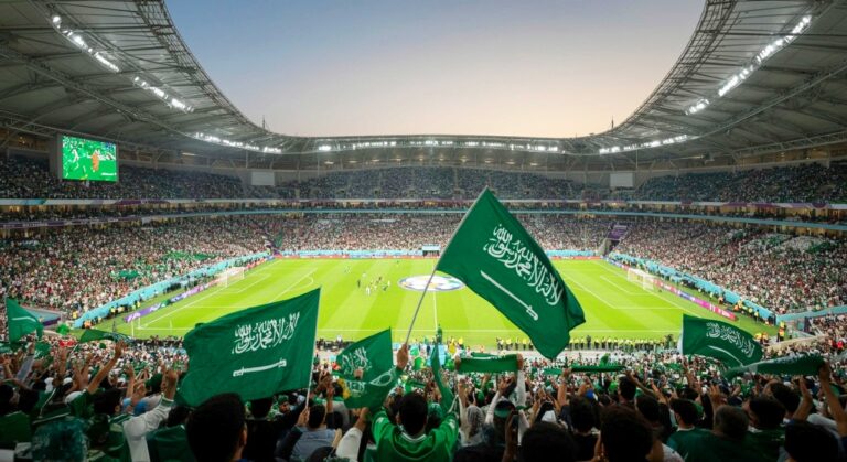 Stadium with Saudi Arabia's flags flying in the audience.