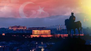 View of Ankara at dusk, with Turkish flag superimposed in the background.