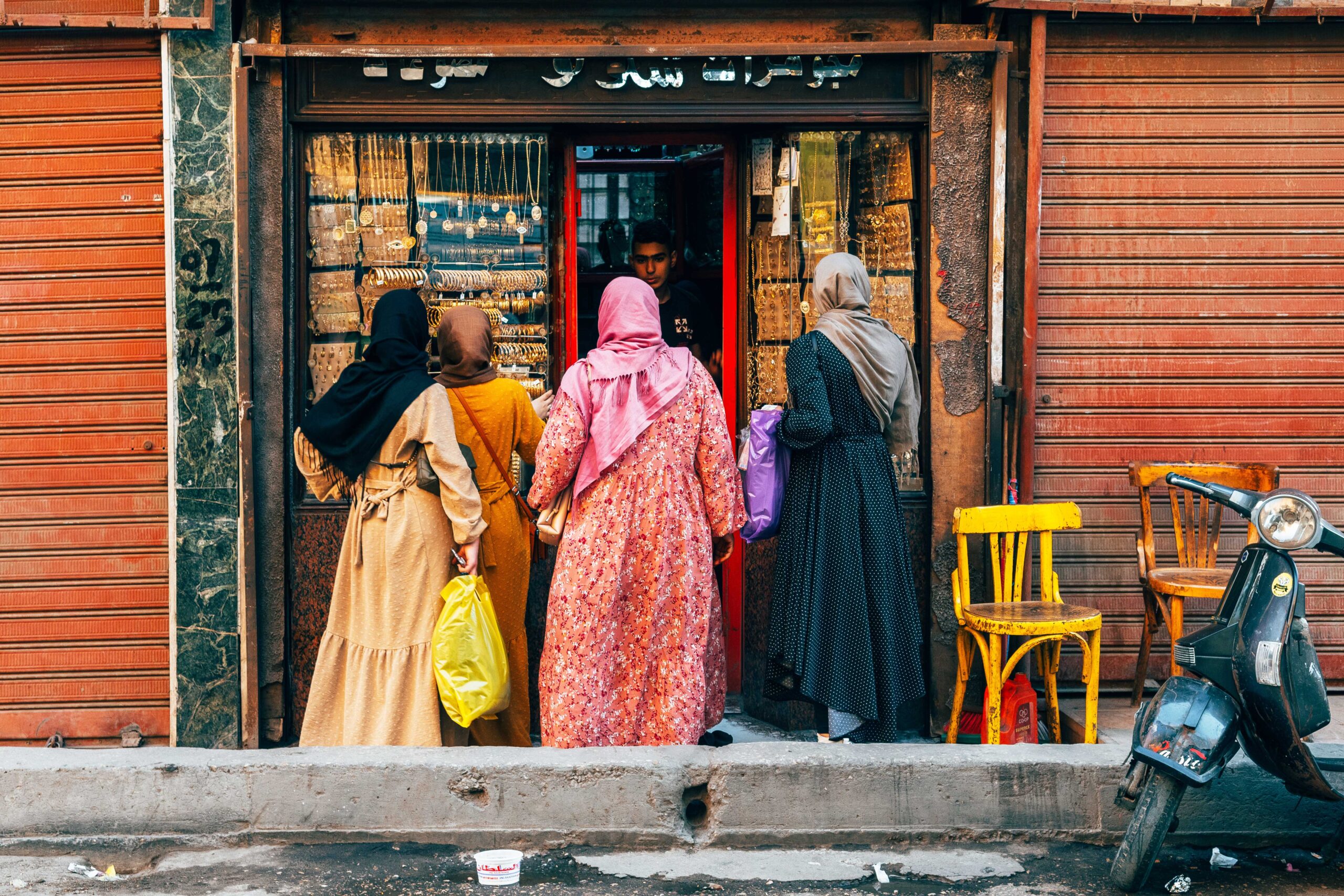 Women standing in front of a jewelry shop in Cairo, Egypt.