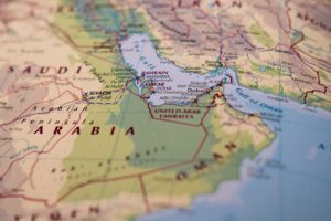 Oman, Middle East - Circa July 2019: Shallow focus showing the Straight of Hormuz sensitive waterway located in the Persian gulf. Neighbouring, out of focus areas including Iran and Saudi are visible.