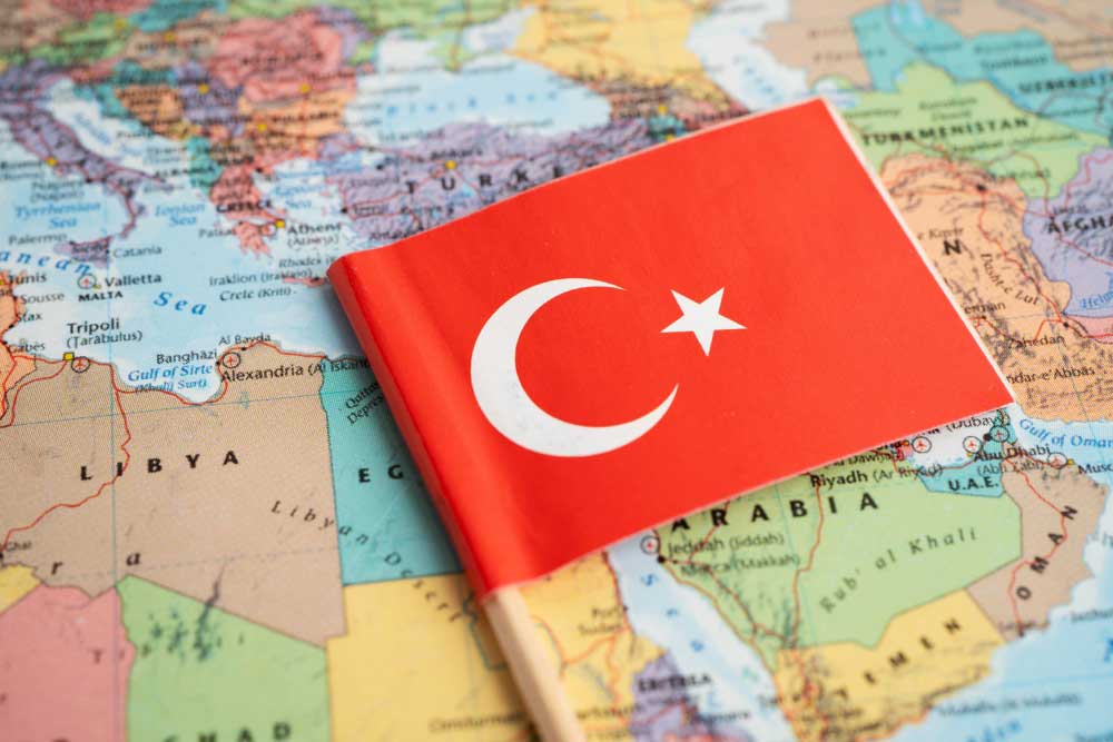 Turkey flag on Middle East map background.