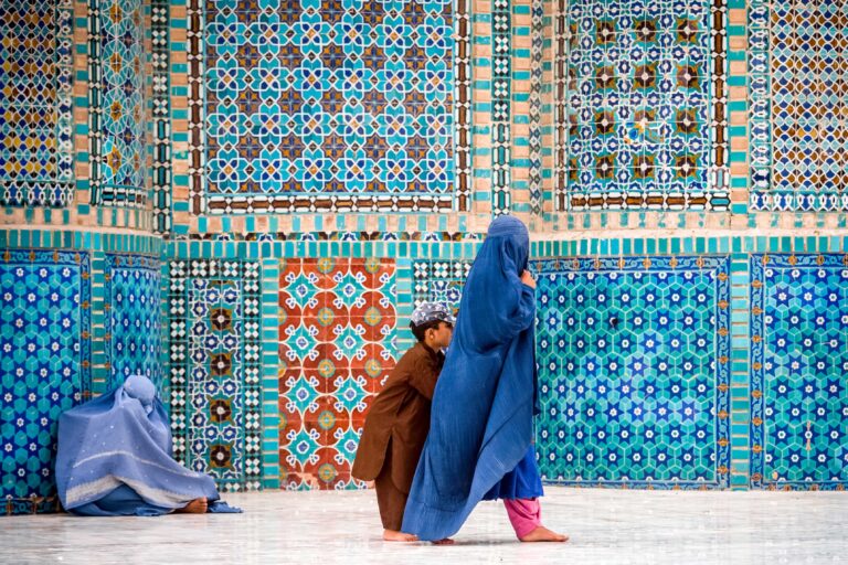 Mazar-i-Sharf Afghanistan - Yune 11, 2011: afghan woman near Blue Mosque in Mazar-i-Sharf city