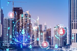 Skyscrapers of Dubai business downtown. International hub of trading and financial services. Social network icons hologram, concept of human resources. Double exposure. Dubai Canal waterfront.