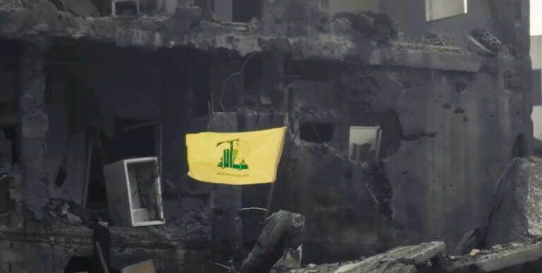 Beirut, Lebanon - January 08, 2025 - Hezbollah Flag Between the Destructed Buildings