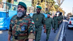 Tehran Iran - November 4, 2022, a line of Iranian Islamic Revolutionary Guard Corps troops crossing the street. In the march, military forces were present with the people.