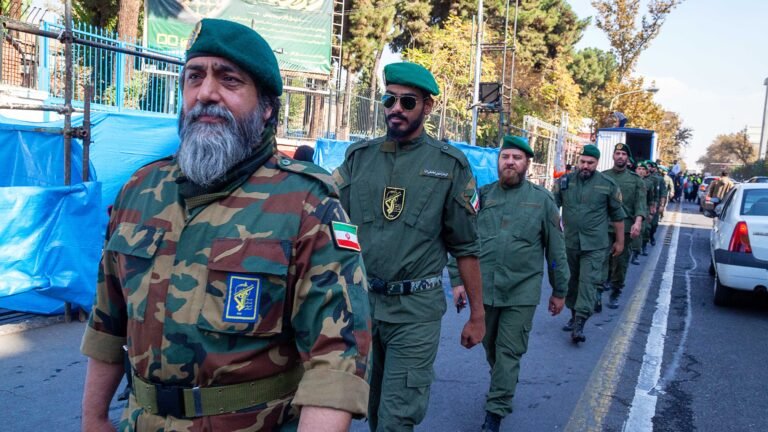 Tehran Iran - November 4, 2022, a line of Iranian Islamic Revolutionary Guard Corps troops crossing the street. In the march, military forces were present with the people.