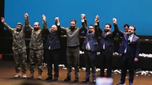 Syrian President Ahmad Al-Sharaa appears in military uniform during a ceremony held at the Presidential Palace, marking the first anniversary of the fall of the Assad regime.