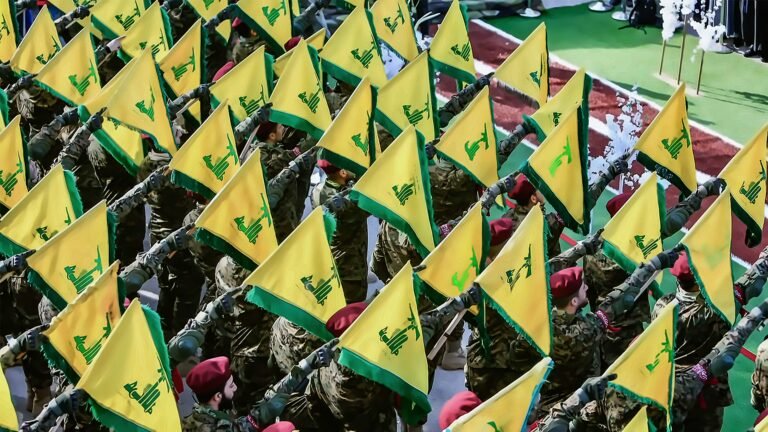 Aitaroun, Lebanon - October 20, 2020 - Hezbollah Members carry the Yellow Flag at During a Military Show South Lebanon