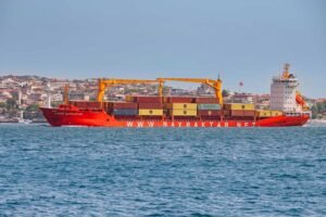 Istanbul, Turkey: A large cargo vessel at a bustling port along the Bosphorus, showcasing the busy maritime trade and logistics of shipping industry