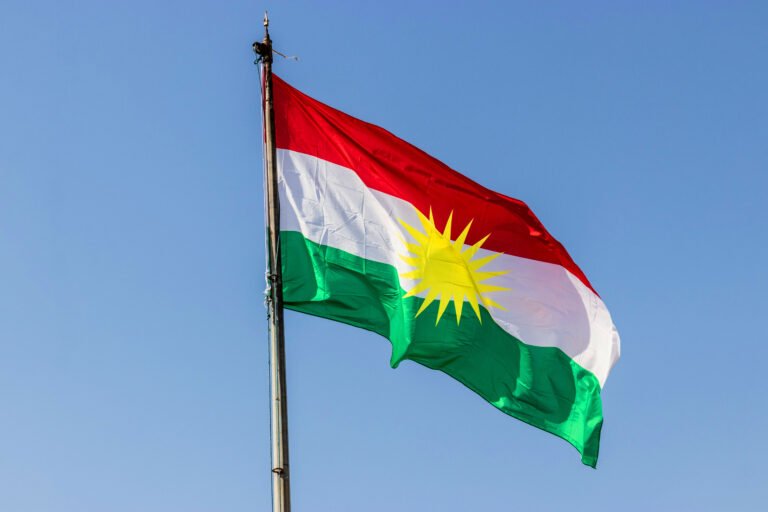 Flag of Kurdistan above Koy Sanjaq town, Kurdistan Region of Iraq