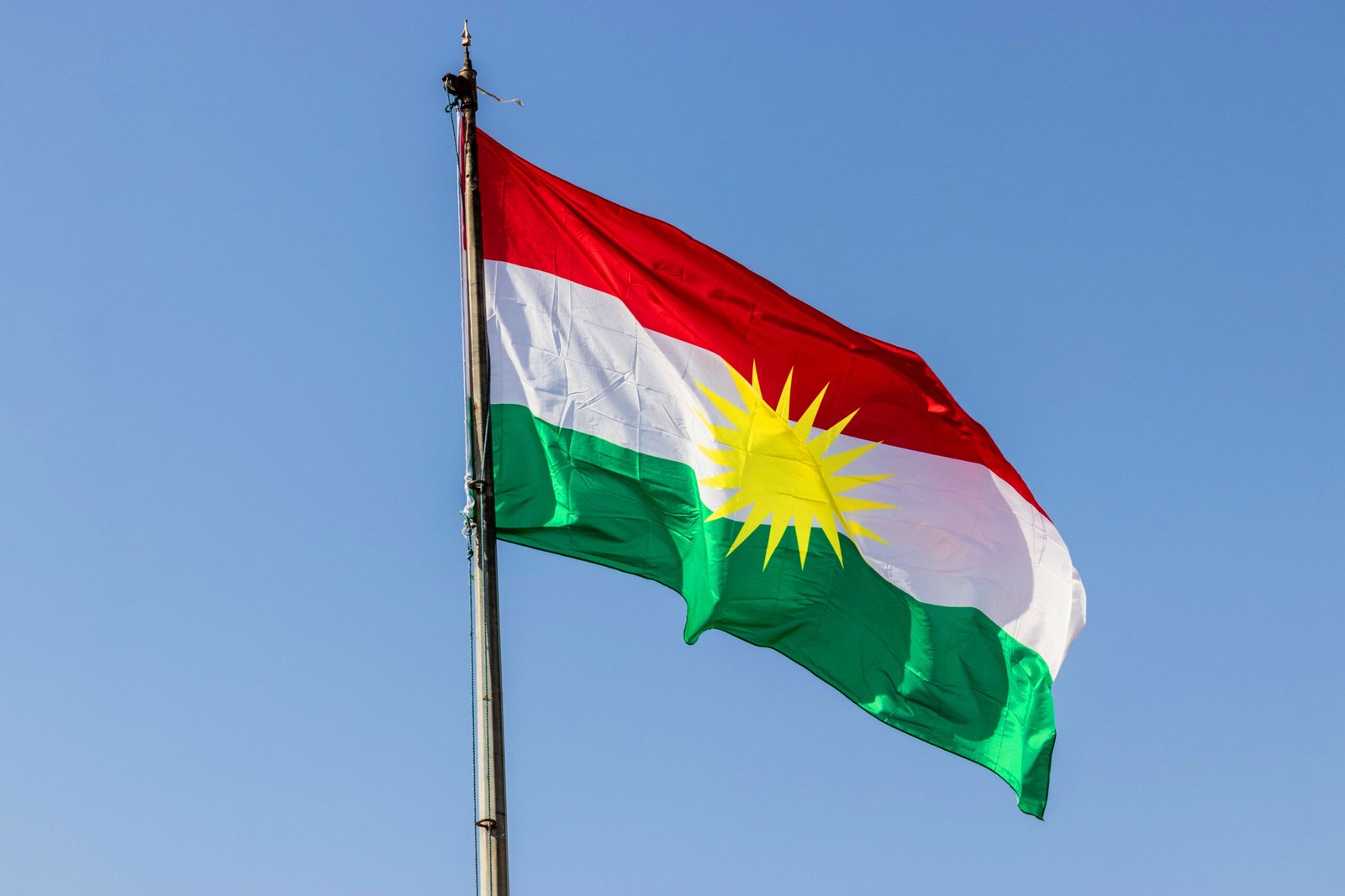Flag of Kurdistan above Koy Sanjaq town, Kurdistan Region of Iraq